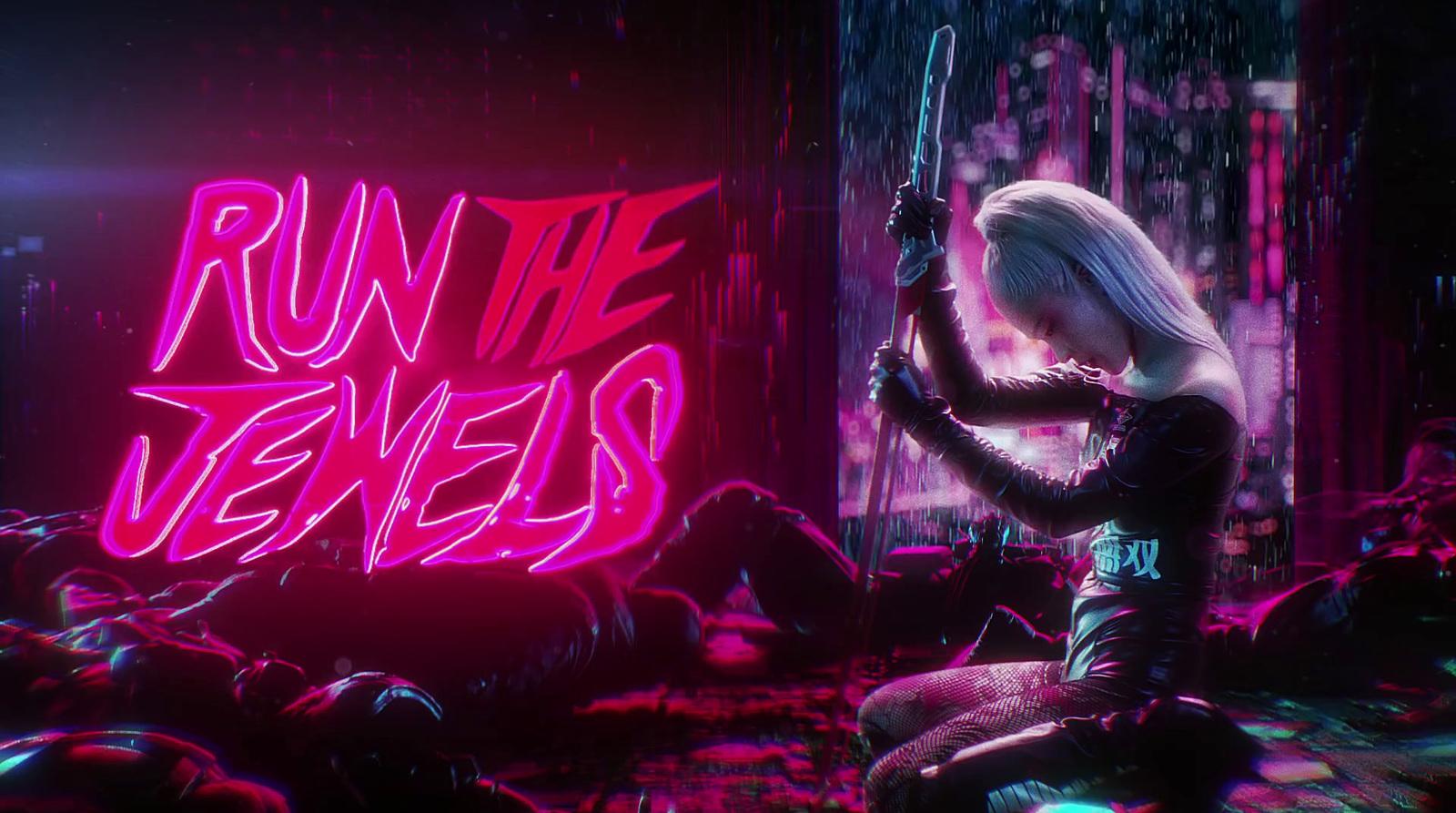 a woman sitting on the ground in front of a neon sign