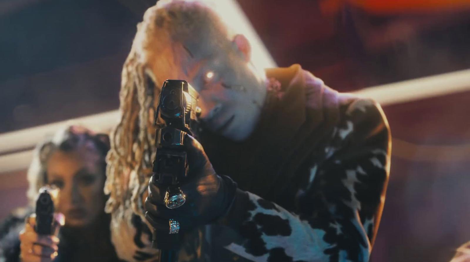 a man holding a gun in his right hand