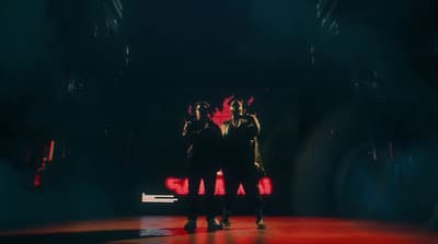 a group of people standing on top of a stage