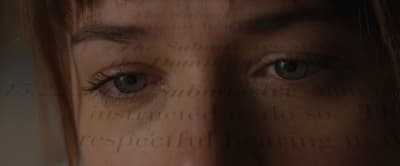 a close up of a person's face with a blurry background