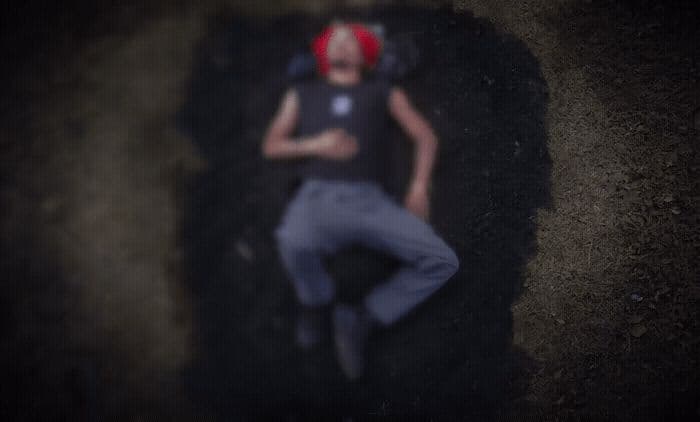 a woman laying on the ground with a red headband