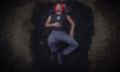 a woman laying on the ground with a red headband