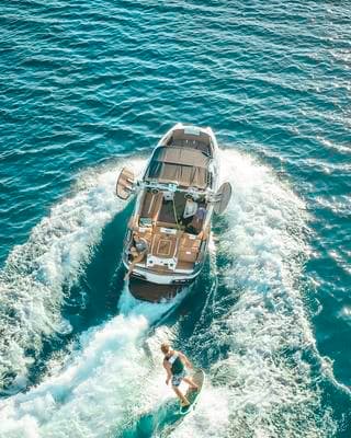a couple of people riding on the back of a boat