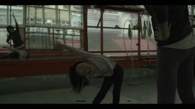 a woman is doing a handstand on the ground