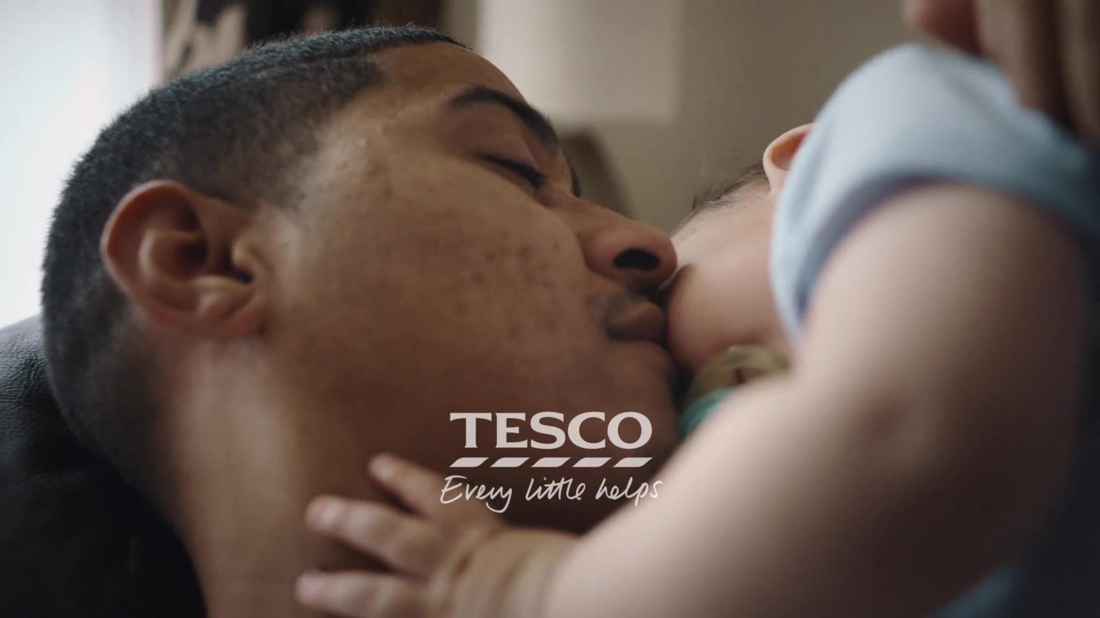 a man holding a baby in his arms