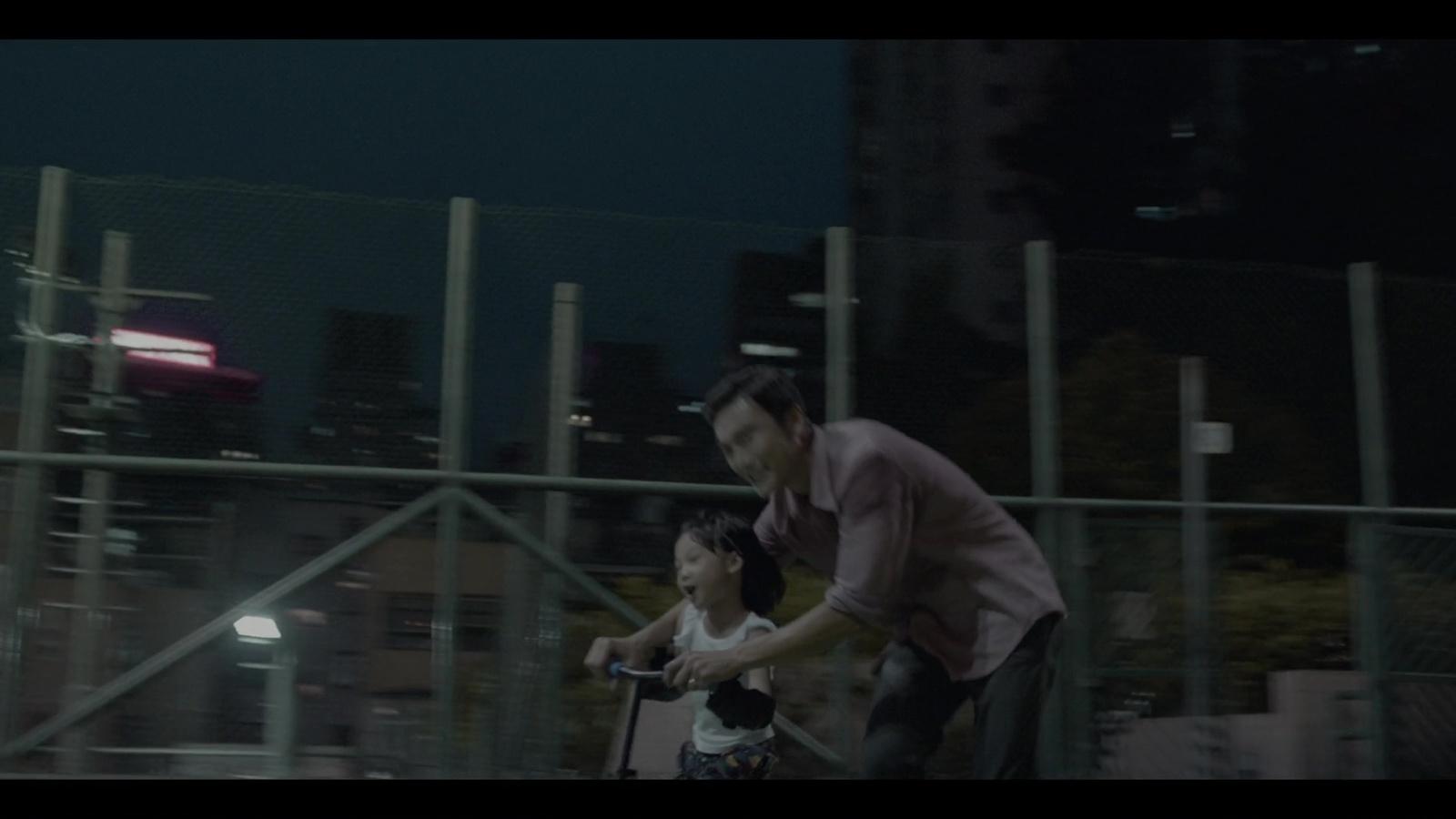 a man and a little girl riding a scooter