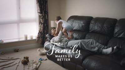 a man and a child laying on a couch