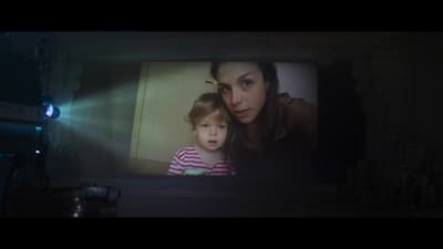 a woman and a child on a television screen