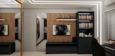 a room with a desk, bookshelf and pictures on the wall