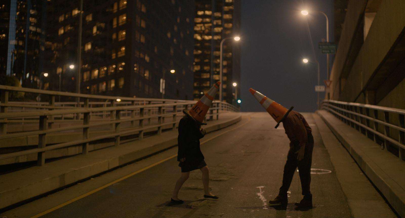 a couple of people that are standing on a bridge