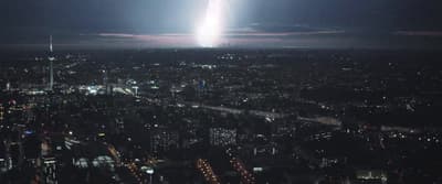 a city at night with a lot of lights in the sky