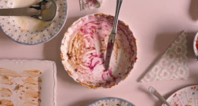 a table topped with plates and bowls filled with food