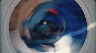 a blurry photo of a person in a washing machine