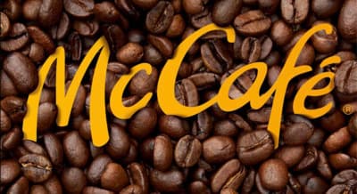 a pile of coffee beans with the word mccaf on it