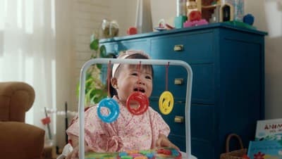 a little girl that is sitting in a chair