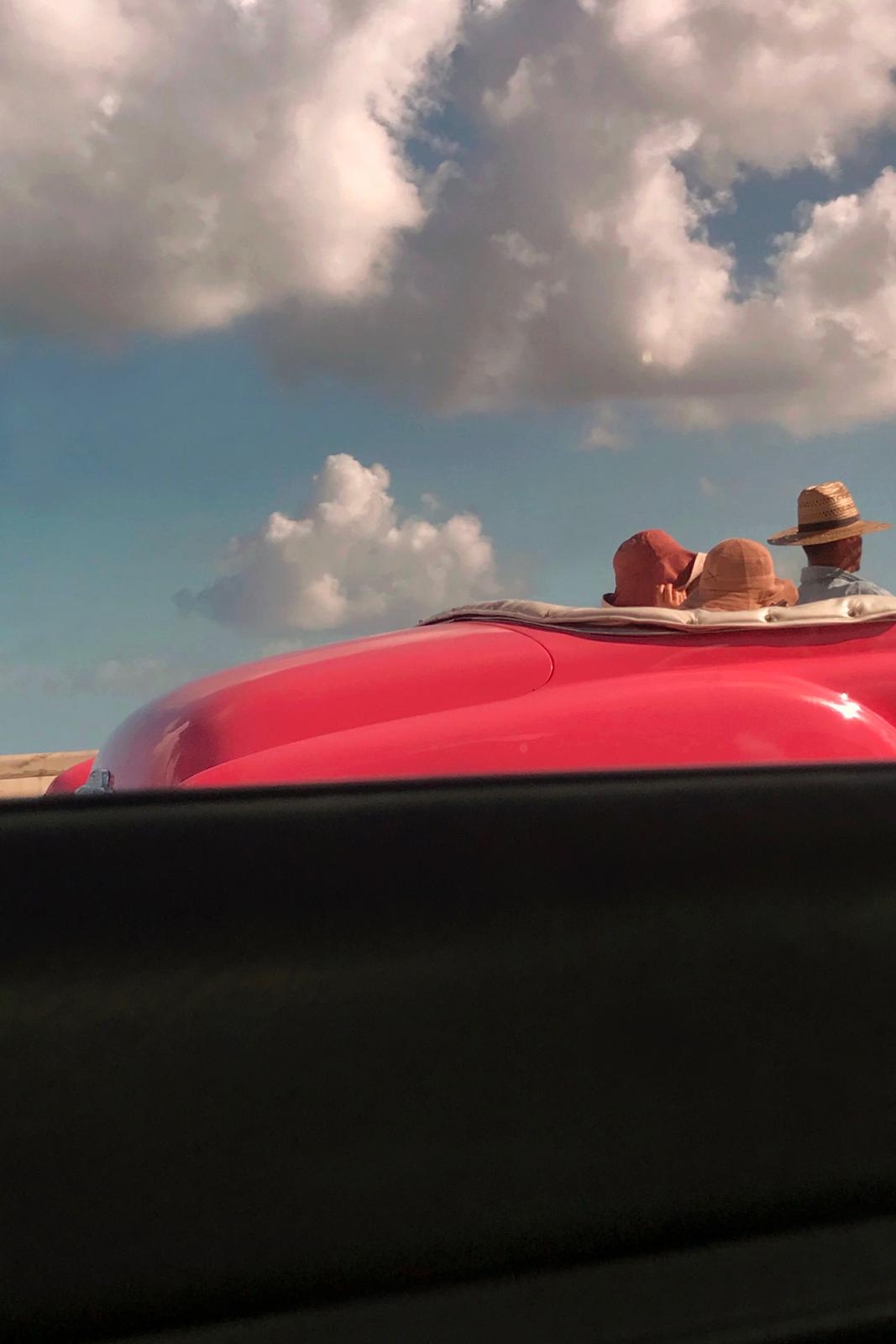 a couple of people that are sitting in a car