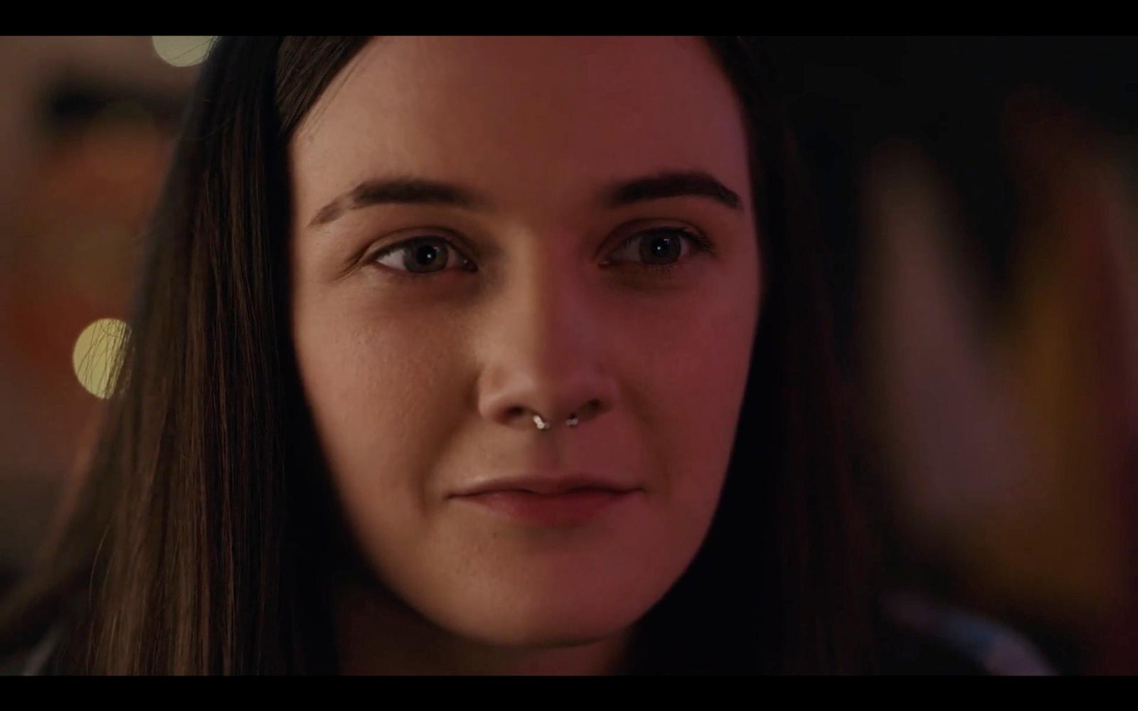 a close up of a person with a nose ring