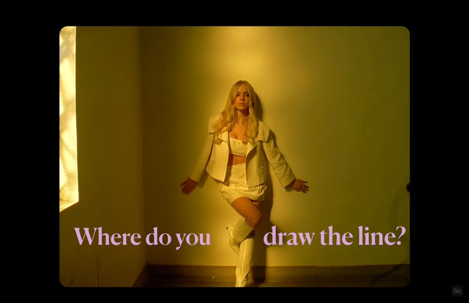 a woman standing in a room with her legs spread out