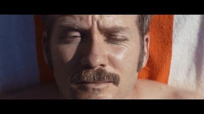 a close up of a man with a mustache
