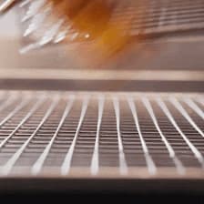 a close up of a microwave with a blurry image of food