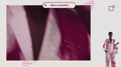 a man in a pink and white striped suit