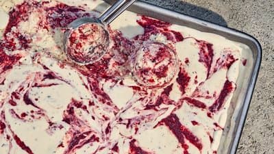 a pan of food that is covered in red and white stuff
