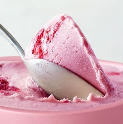 a spoon with a scoop of ice cream in it