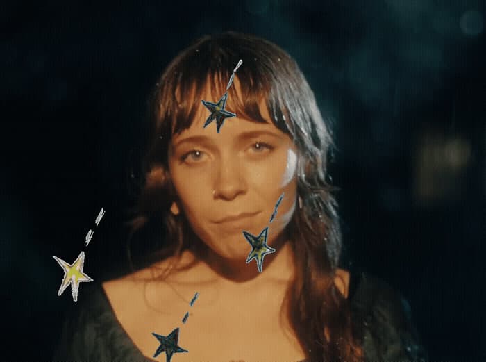 a woman with stars painted on her face