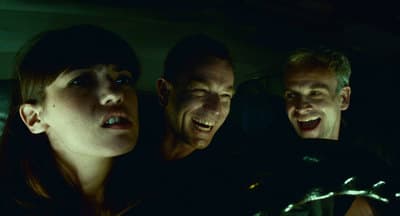 a group of people sitting next to each other