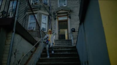 a woman walking down a flight of stairs