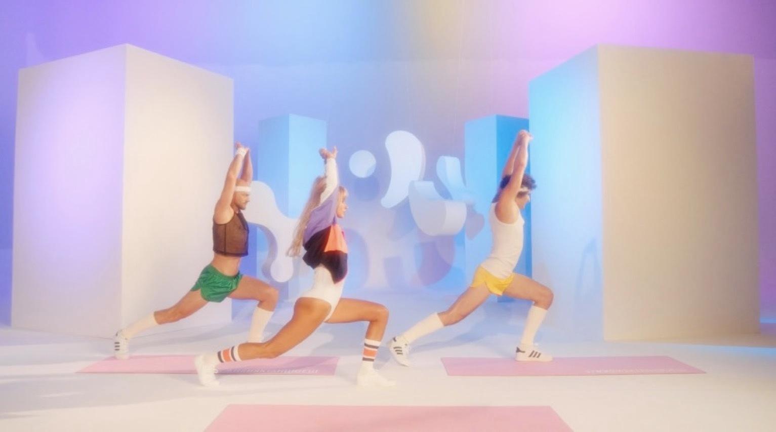 a group of women doing yoga poses in a studio
