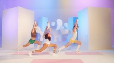 a group of women doing yoga poses in a studio