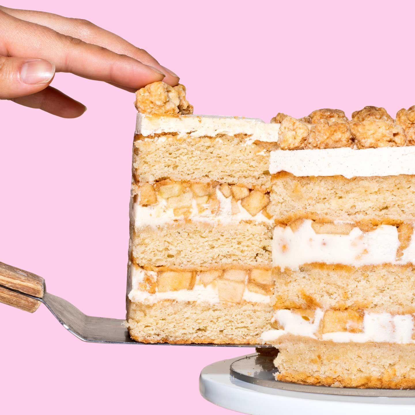 a piece of cake being cut with a knife