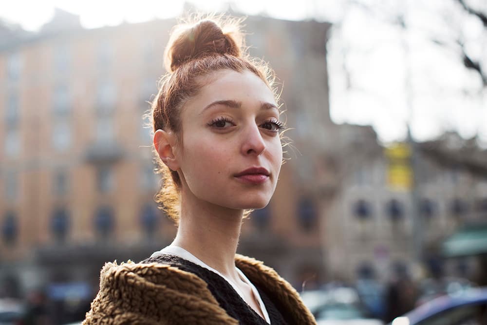 a woman with a bun in her hair