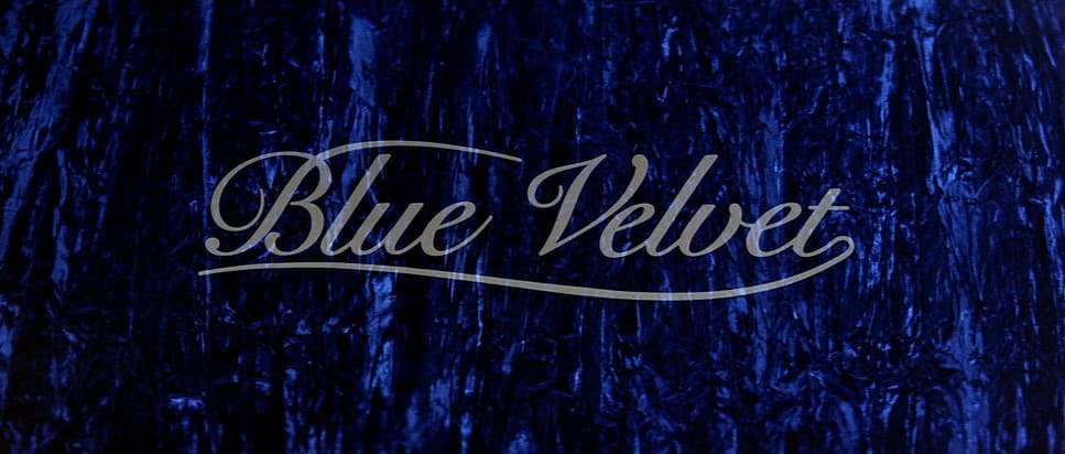 a blue velvet background with the word blue velvet on it