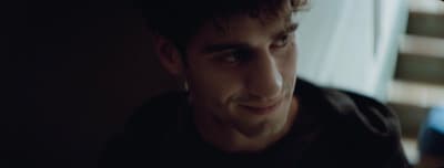 a close up of a person wearing a black shirt