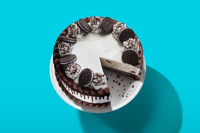 a chocolate cake with oreo cookies on top of it