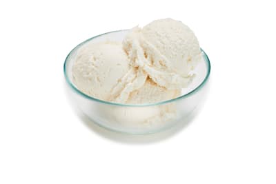 two scoops of ice cream in a glass bowl