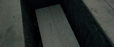 a wooden bench sitting in the middle of a room