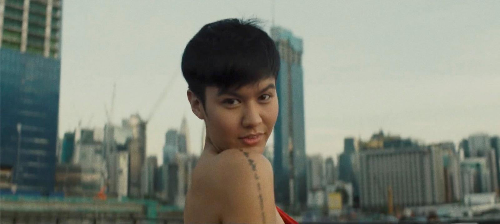 a woman with a tattoo on her shoulder