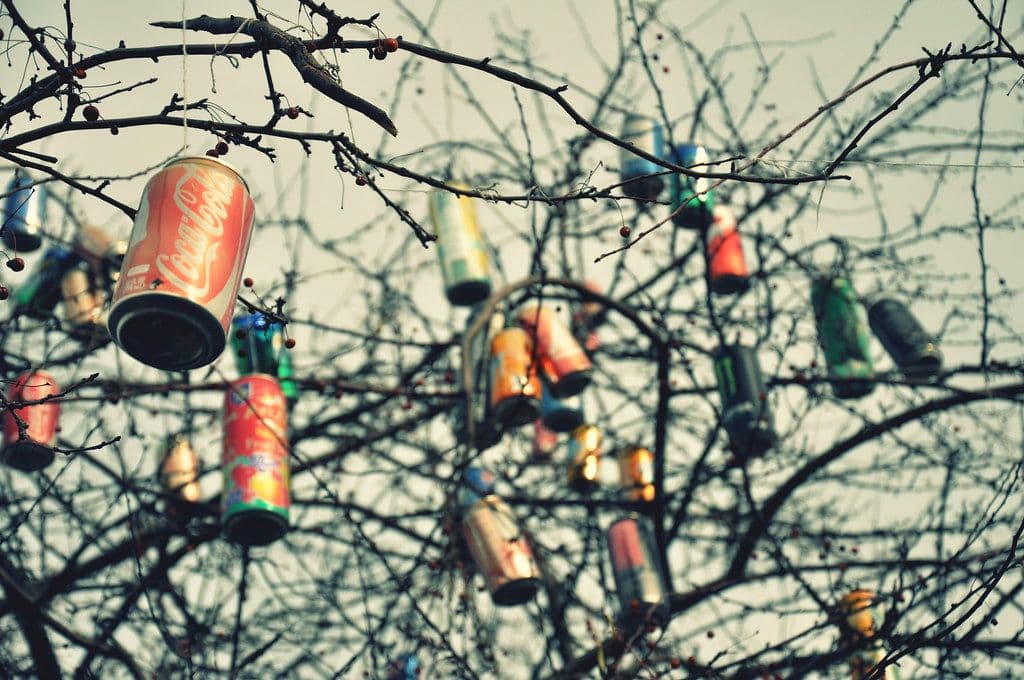 a group of cans hanging from a tree
