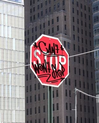 a stop sign has been vandalized with graffiti