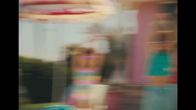 a blurry photo of a carnival ride