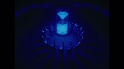 a group of people standing in a dark room