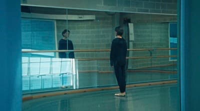 a couple of people that are standing in a room