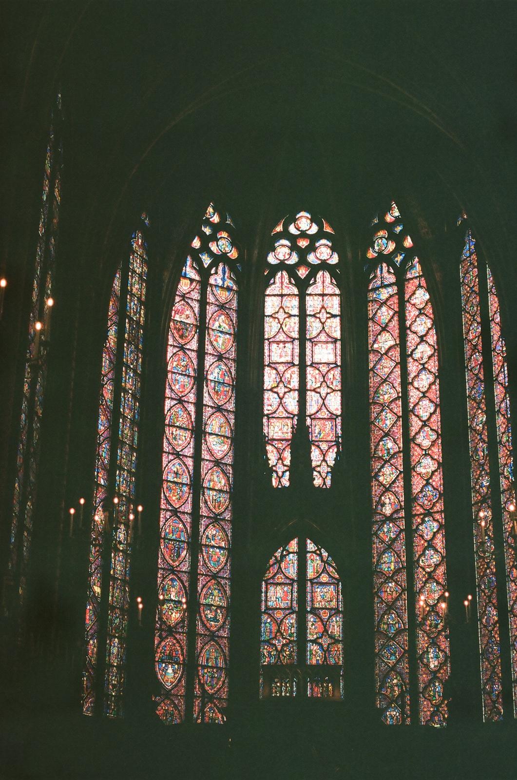 a large stained glass window in a building