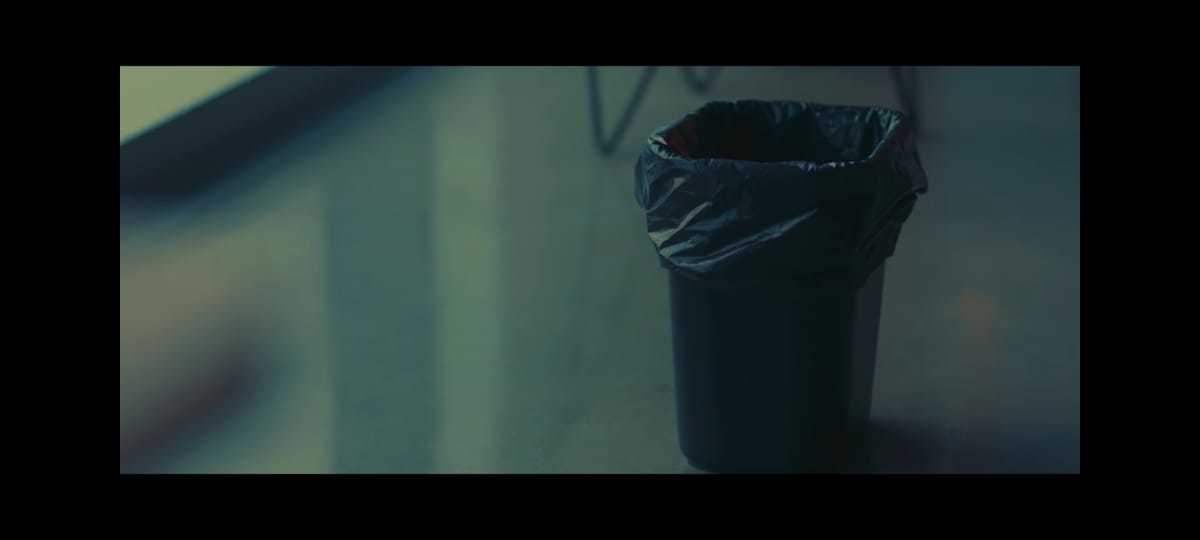 a black trash can sitting on top of a counter