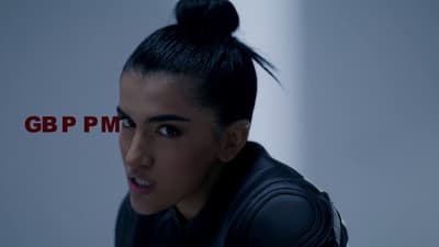 a woman with black hair and a black jacket