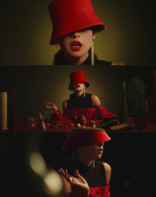 a woman wearing a red hat and black dress