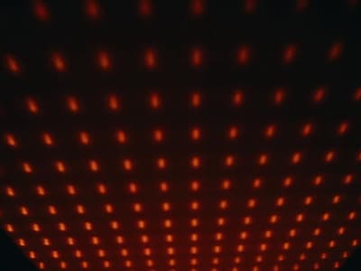 a red light is shining on a wall